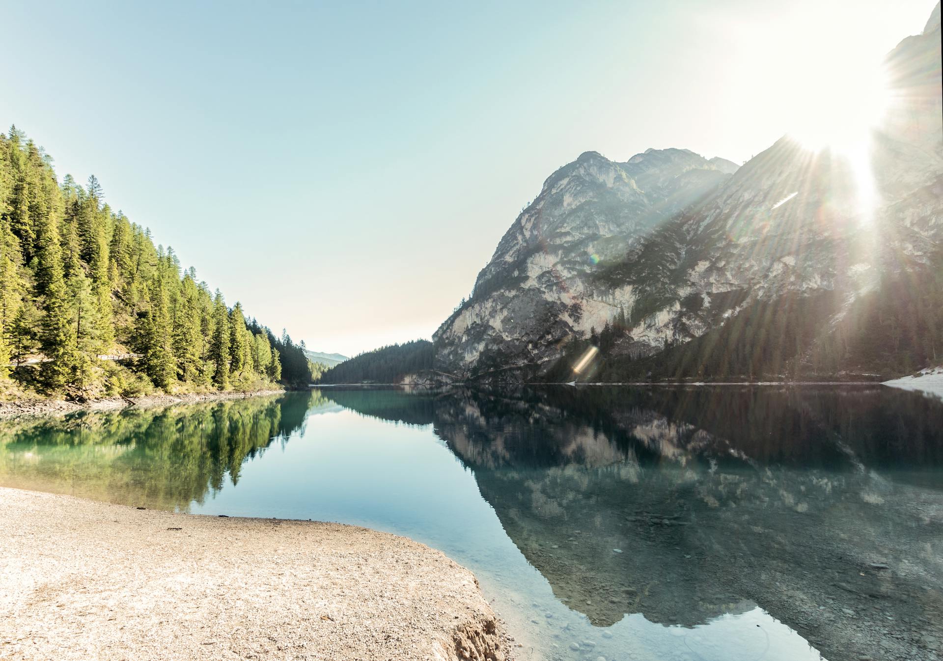 Calm mountain lake at dawn — still waters